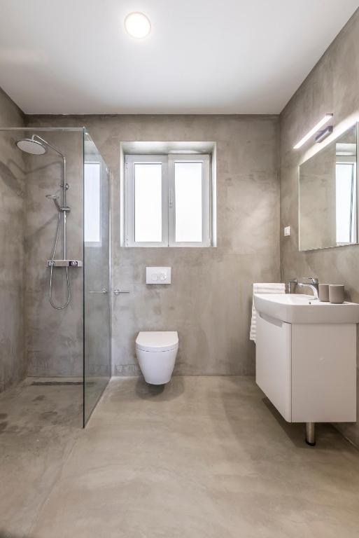 Kúpeľňa v ubytovaní PORTO SERENO apartments