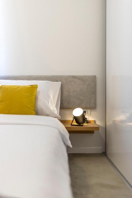 Posteľ alebo postele v izbe v ubytovaní PORTO SERENO apartments
