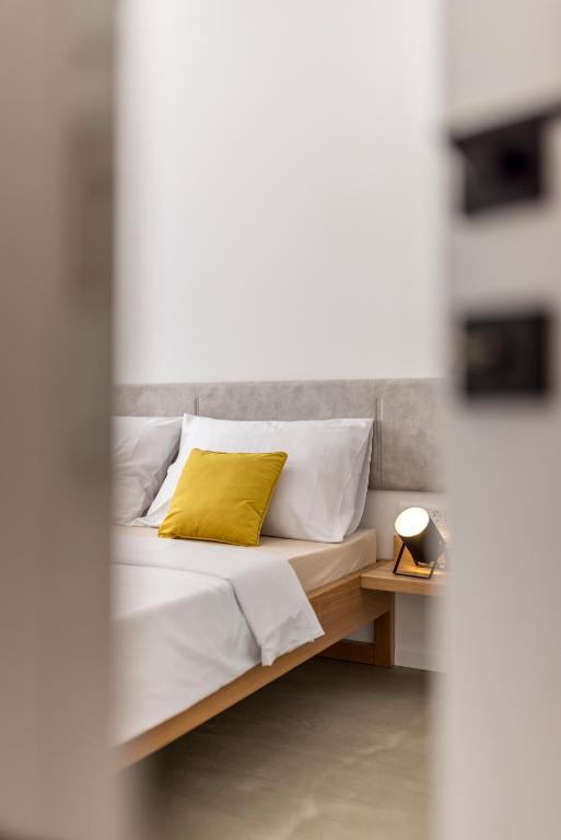Posteľ alebo postele v izbe v ubytovaní PORTO SERENO apartments