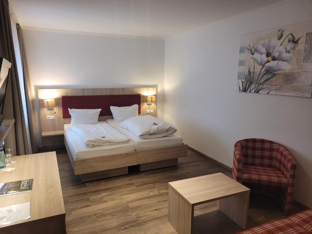 מיטה או מיטות בחדר ב-Hotel Rössle