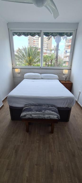 A bed or beds in a room at San Juan Live