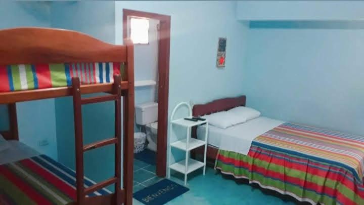 Postel nebo postele na pokoji v ubytování Hostal Aruba