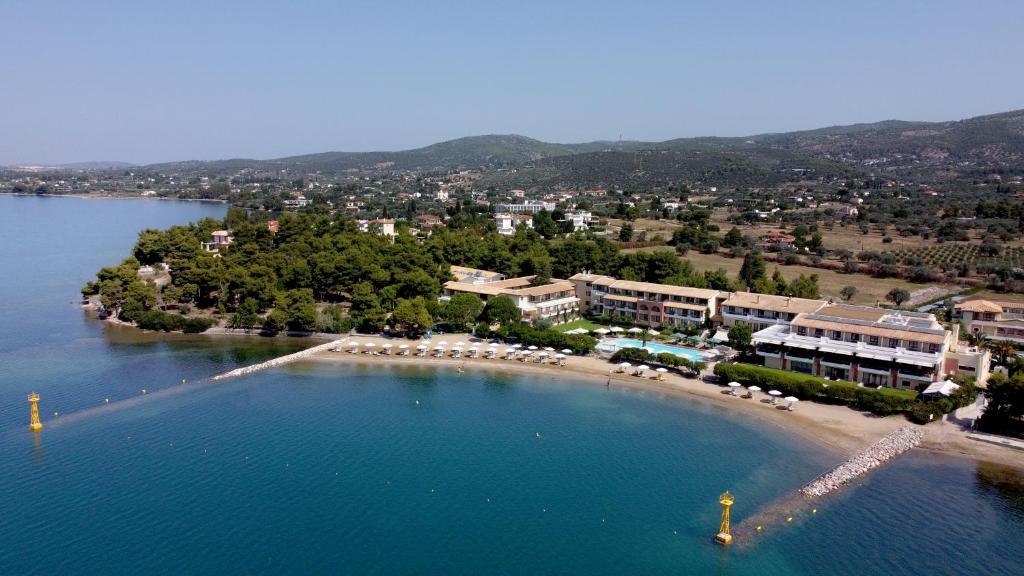 an island in the middle of a body of water at Negroponte Resort Eretria in Eretria