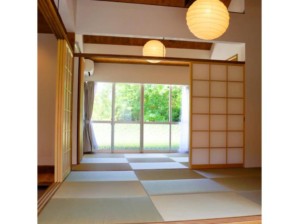 a room with a large window and a tiled floor at Pensione Shimado - Vacation STAY 37555v in Shimonoseki