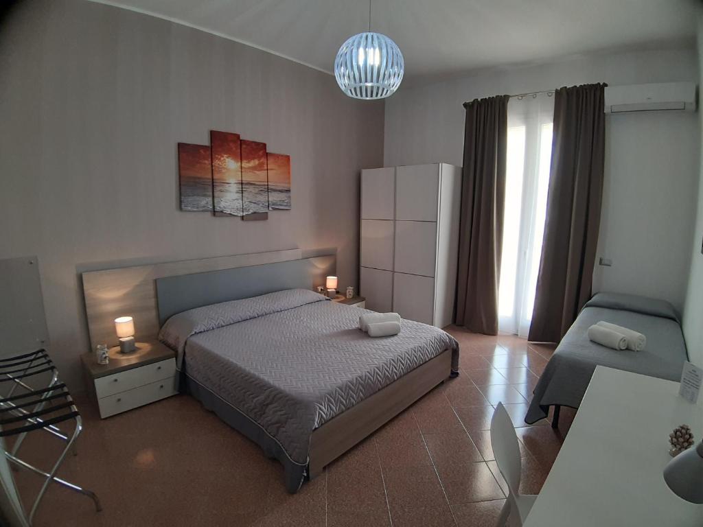 Postel nebo postele na pokoji v ubytování B&B Costa Sicula