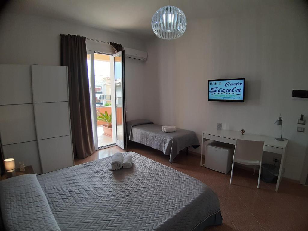 Postel nebo postele na pokoji v ubytování B&B Costa Sicula