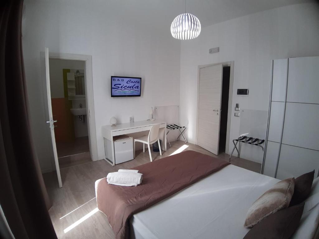 Postel nebo postele na pokoji v ubytování B&B Costa Sicula