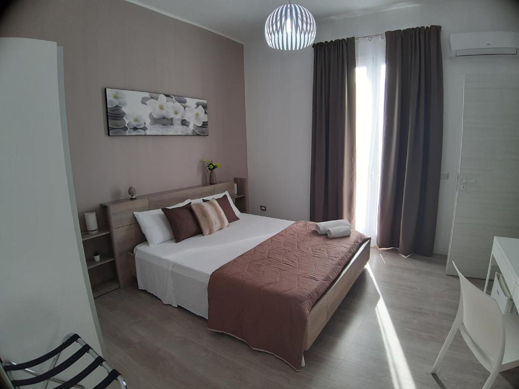 Postel nebo postele na pokoji v ubytování B&B Costa Sicula
