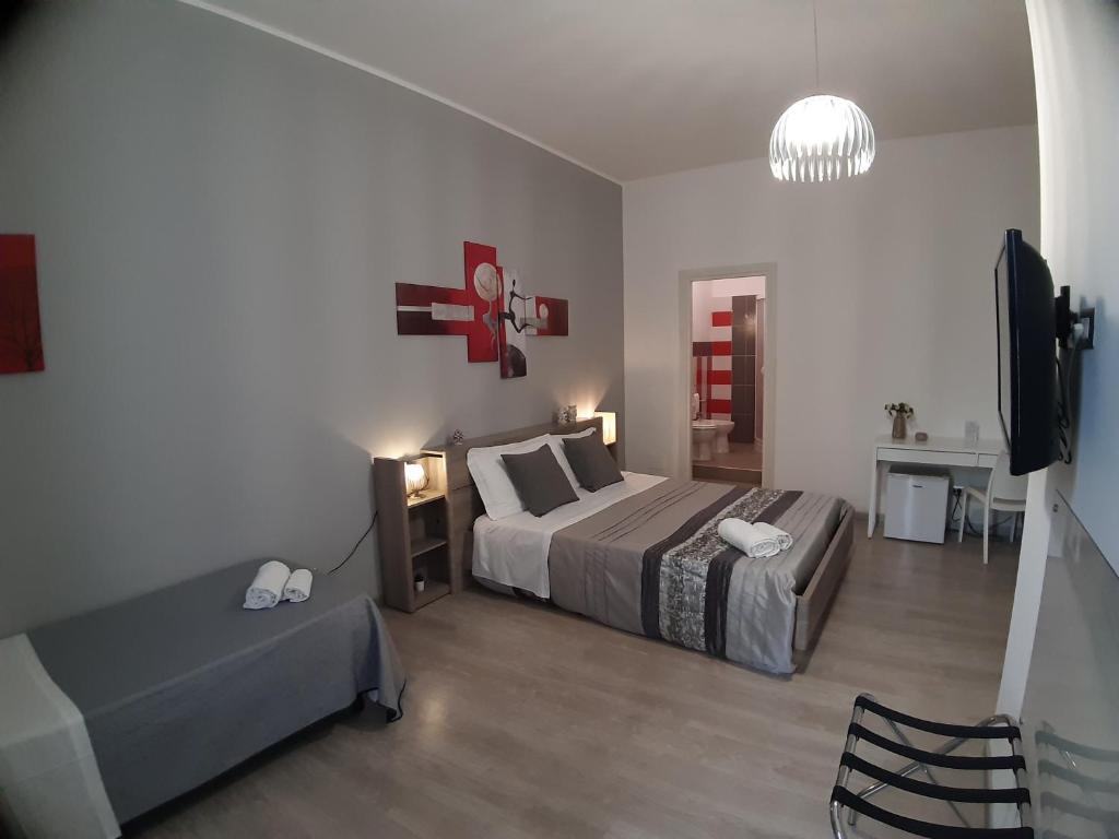 Postel nebo postele na pokoji v ubytování B&B Costa Sicula