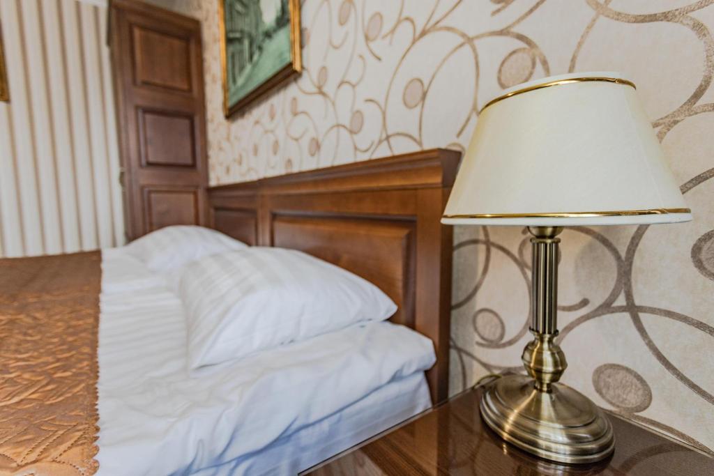 Postel nebo postele na pokoji v ubytování Guest House Villa Lamperti