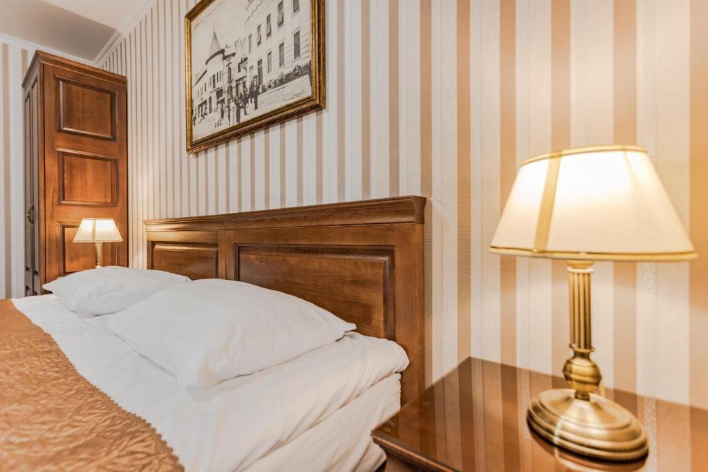 Postel nebo postele na pokoji v ubytování Guest House Villa Lamperti