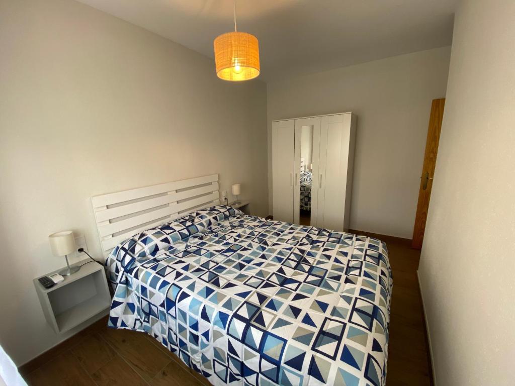 A bed or beds in a room at Arenales Sol y Playa Galatea I