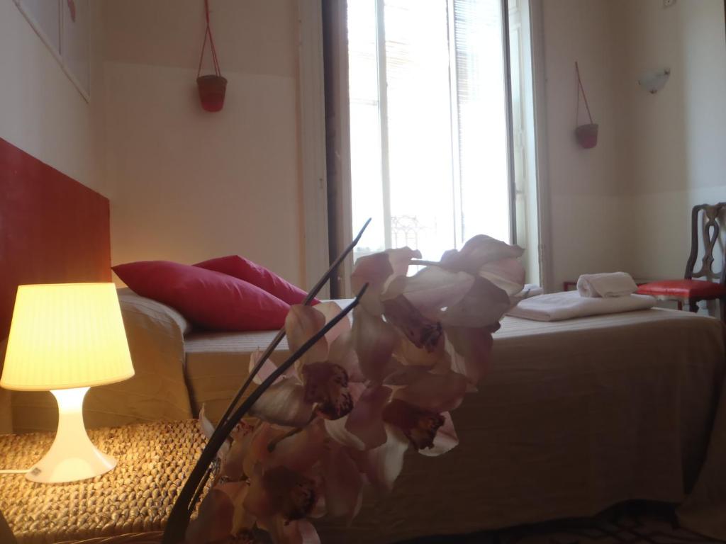 Łóżko lub łóżka w pokoju w obiekcie Gianluca's Room