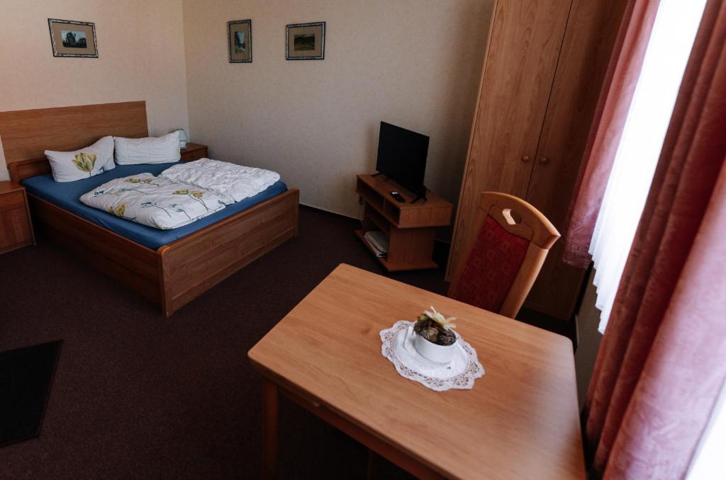 Postel nebo postele na pokoji v ubytování Pension Kristall