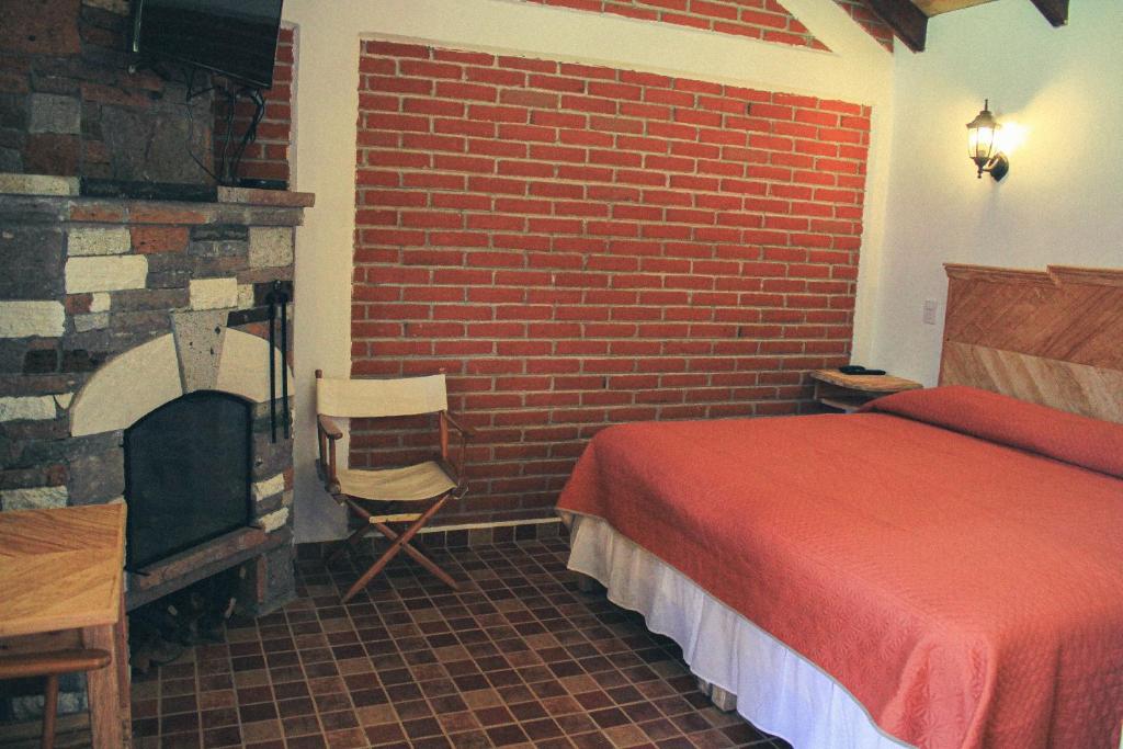Postel nebo postele na pokoji v ubytování Cabañas Rincón Escondido