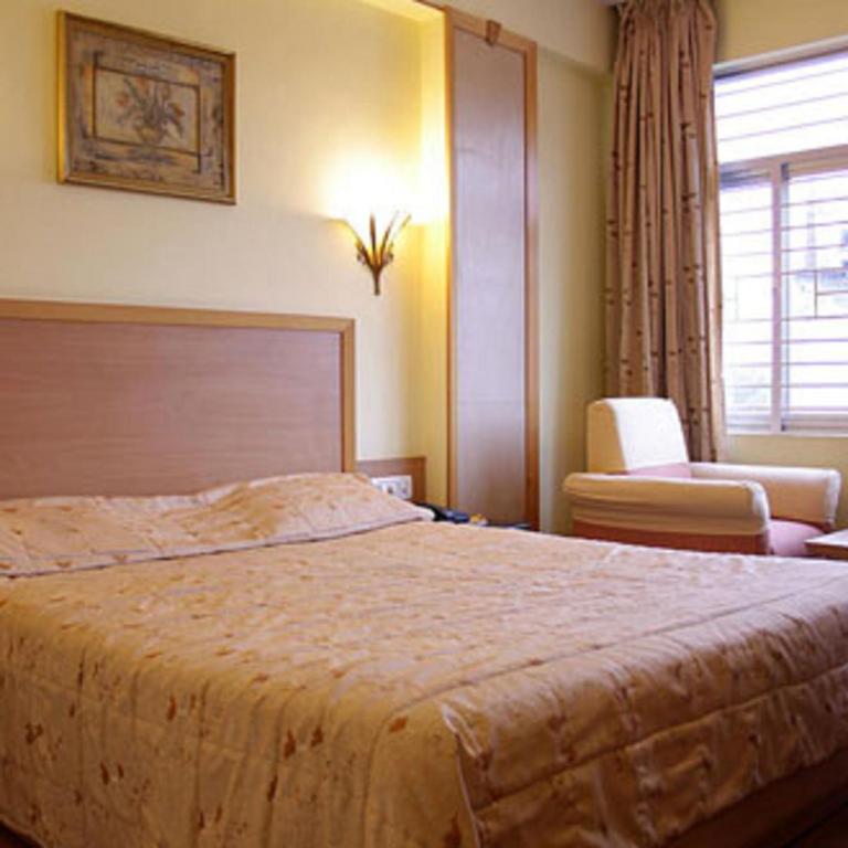 Postel nebo postele na pokoji v ubytování Hotel Roopa