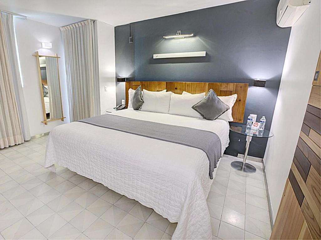 Postel nebo postele na pokoji v ubytování Hotel CLARUM 101