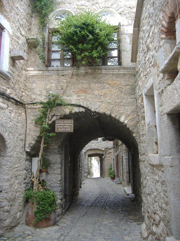 an alley in an old stone building with a tunnel at Karampela Despina in Mestá