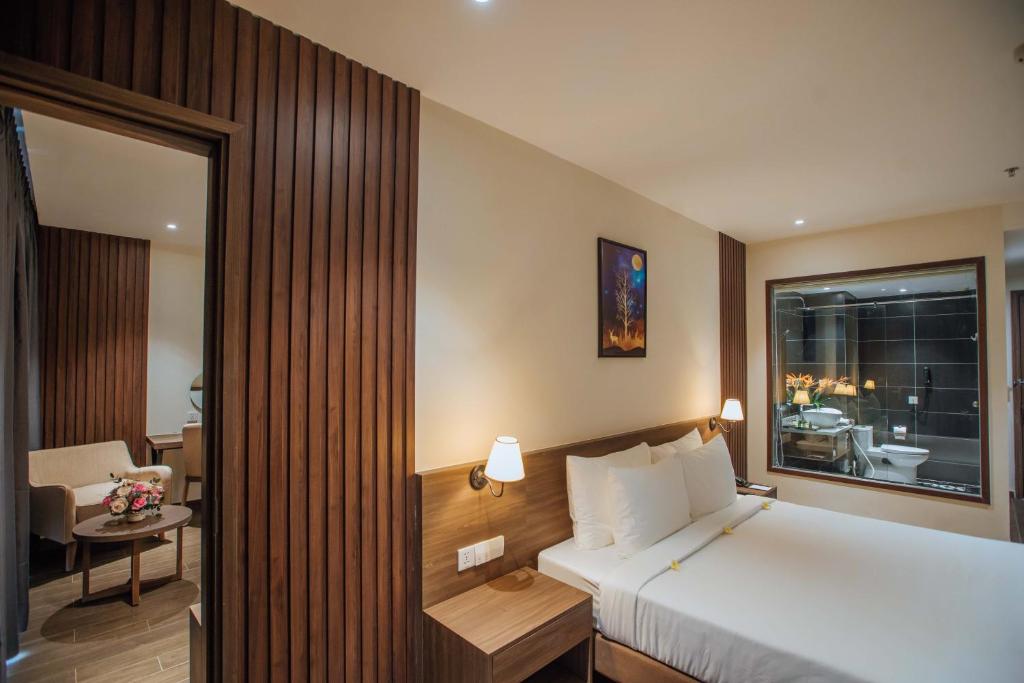 Postel nebo postele na pokoji v ubytování Celina Peninsula Resort Quảng Bình