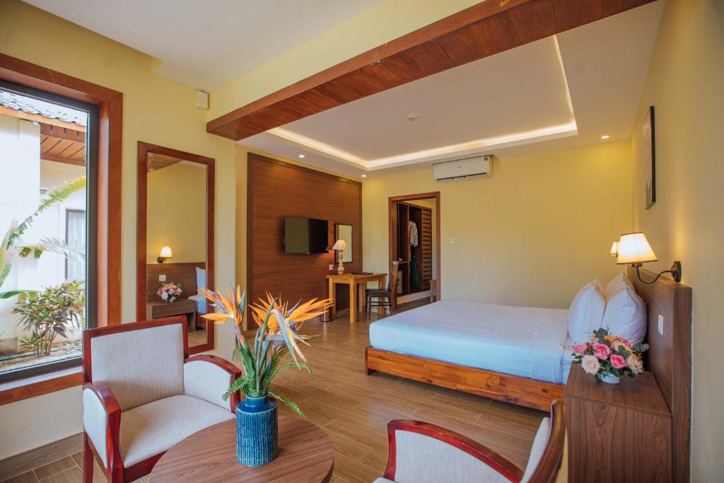 Postel nebo postele na pokoji v ubytování Celina Peninsula Resort Quảng Bình