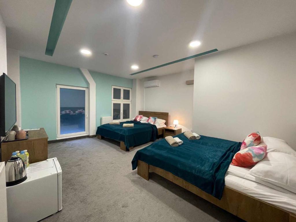 Postel nebo postele na pokoji v ubytování Hotel Story