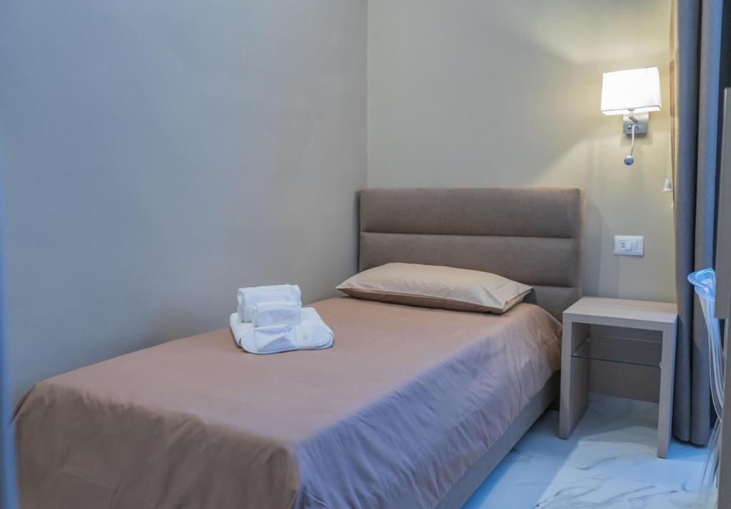 Postel nebo postele na pokoji v ubytování Le Suite