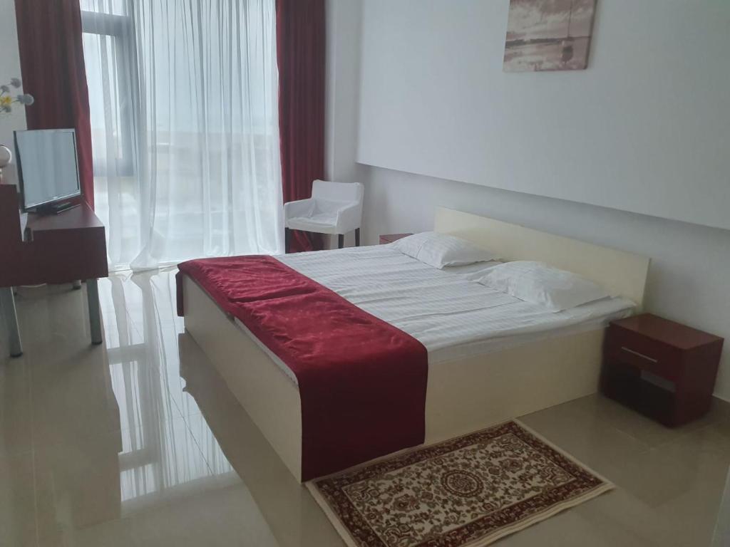 Postel nebo postele na pokoji v ubytování Hotel Hefaistos - Mamaia