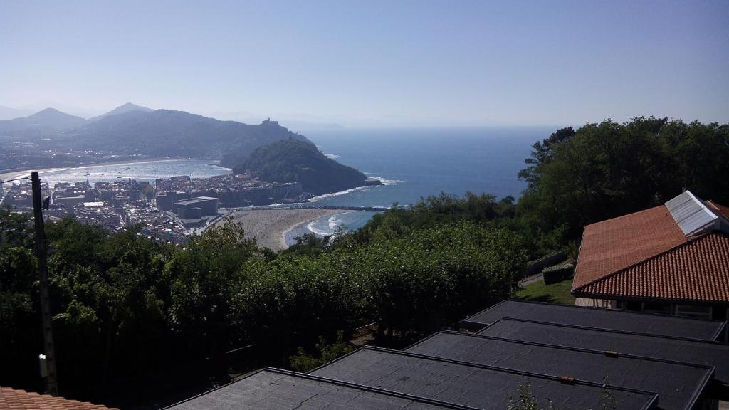 a view of the ocean from a house at Albergue/Auberge ULIA Youth Hostel in San Sebastián