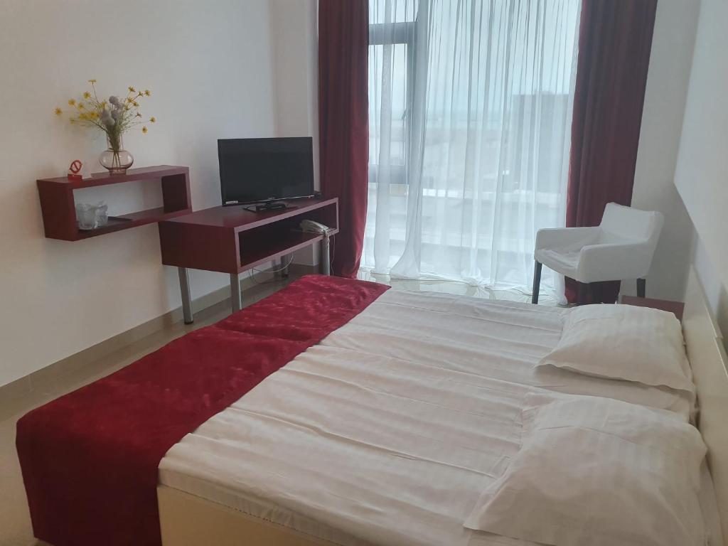 Postel nebo postele na pokoji v ubytování Hotel Hefaistos - Mamaia