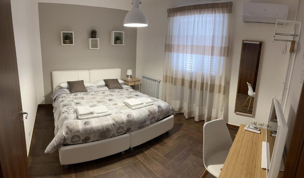 A bed or beds in a room at Il Borghetto di San Giuseppe EtnaRooms&Apartments