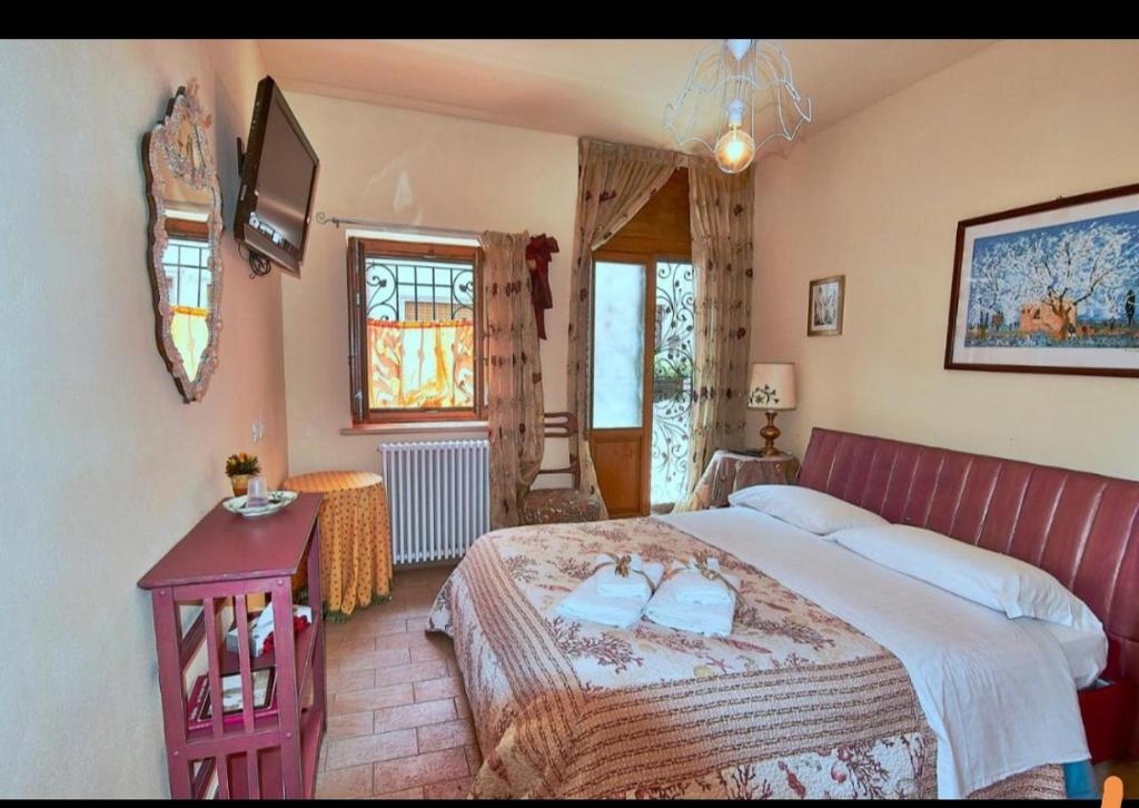 Posteľ alebo postele v izbe v ubytovaní Del Castello