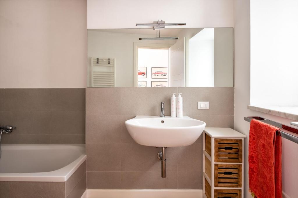 A bathroom at Vittorio Emanuele apartment with terrace by Wonderful Italy