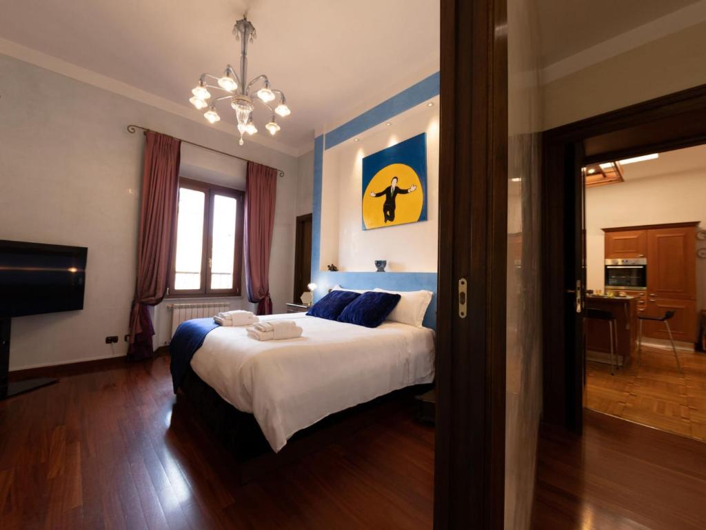 Łóżko lub łóżka w pokoju w obiekcie The Best Rent - Apartment with a view on Altare della Patria