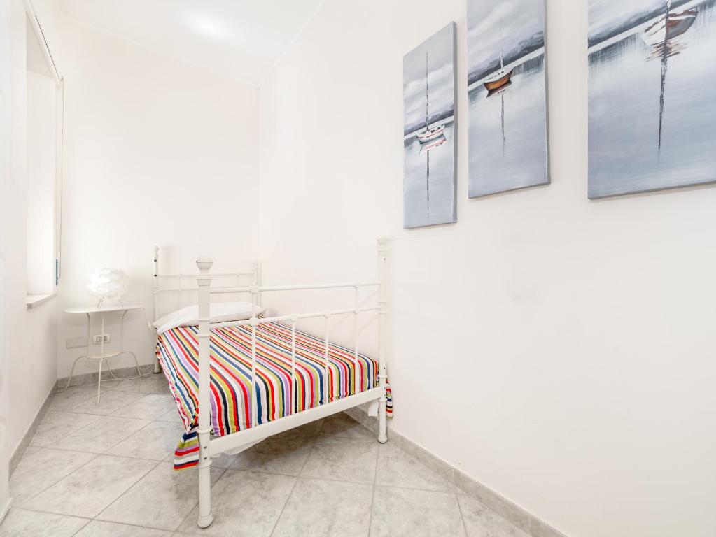 Łóżko lub łóżka w pokoju w obiekcie YourHome - Corso Italia Apt in Sorrento