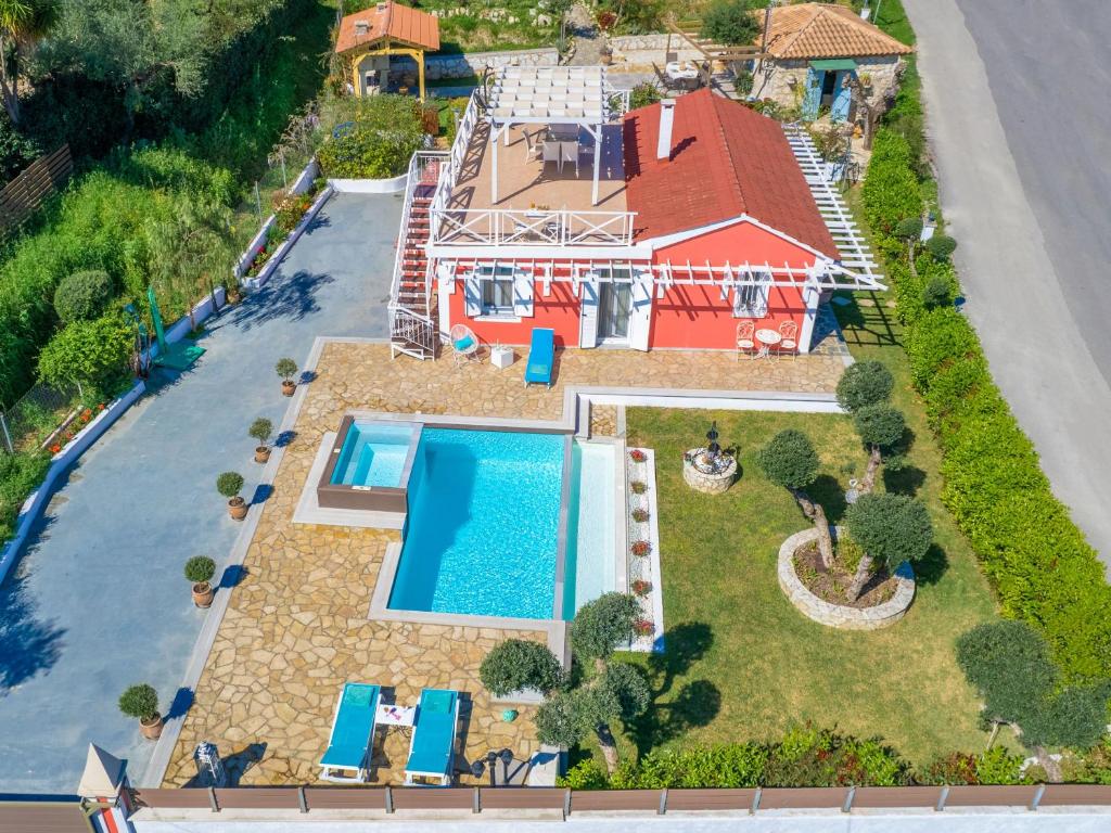 an aerial view of a house with a swimming pool at Dorothea Villa in Zakynthos Town