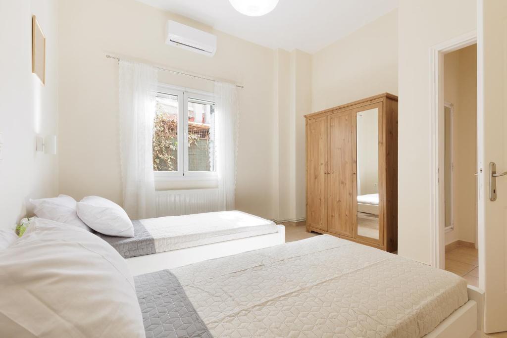 Postel nebo postele na pokoji v ubytování Central Apartments by Konnect, Ipsos