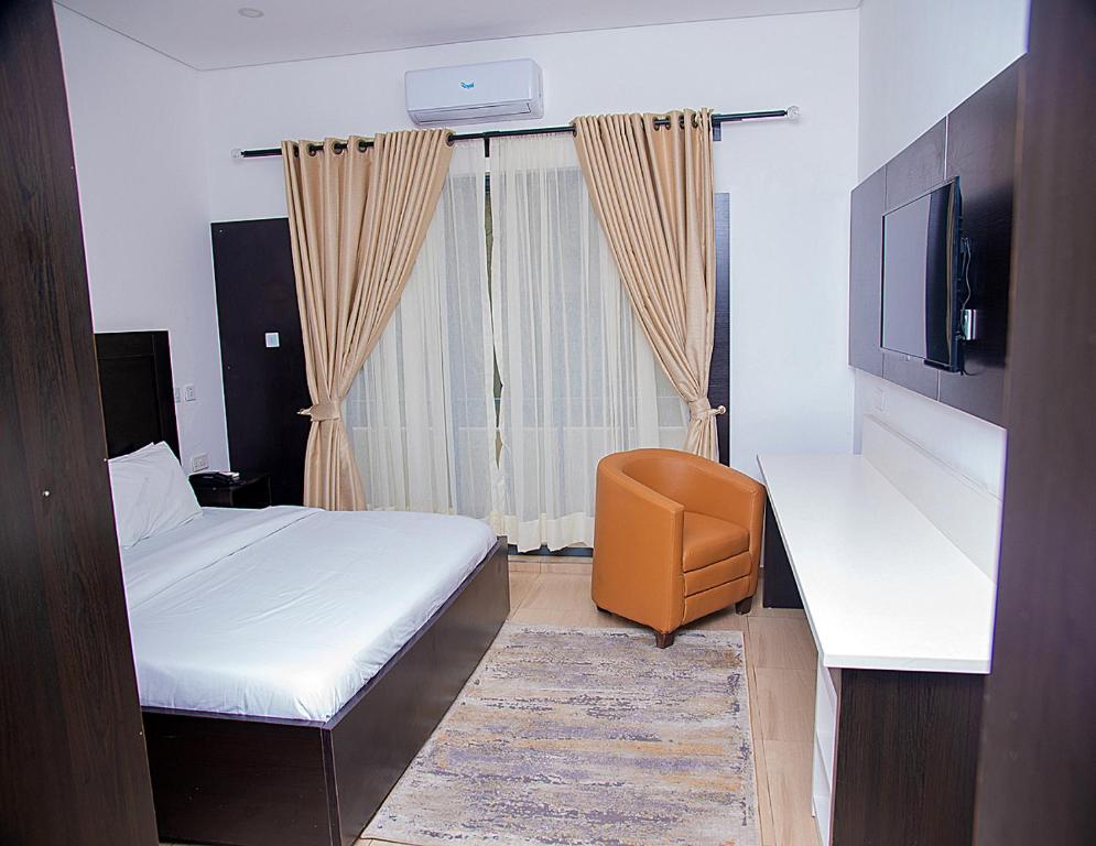 Postel nebo postele na pokoji v ubytování Hotel Capitol