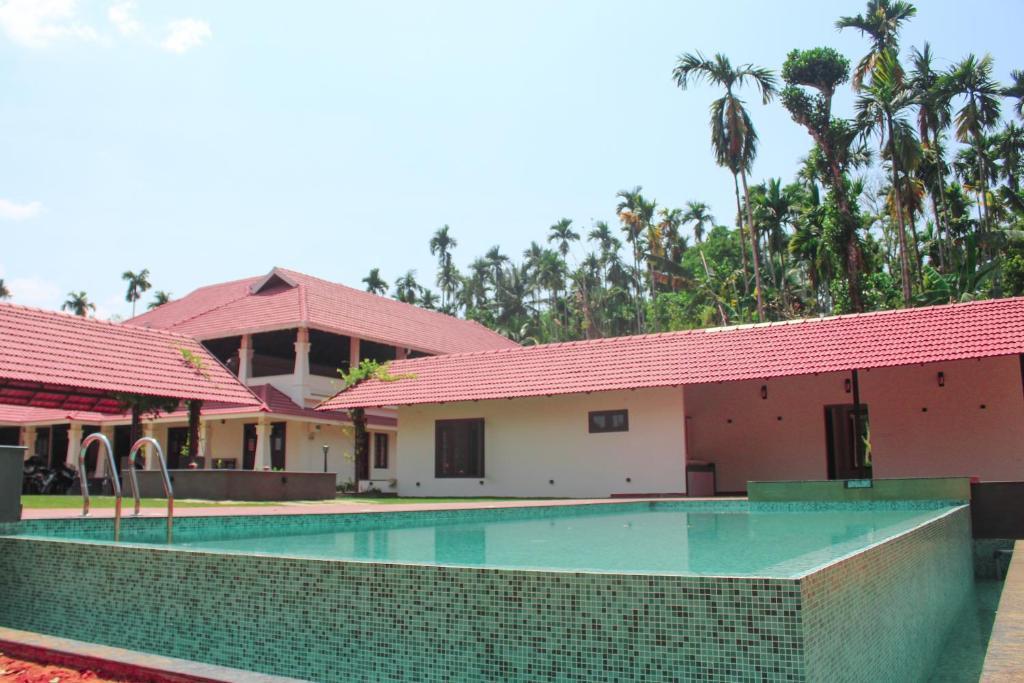 Bazén v ubytování Wayanad Mace Mansion nebo v jeho okolí