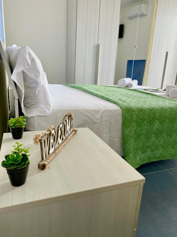 Postel nebo postele na pokoji v ubytování Sperlonga Paradise Suites 500m dal mare in estate Servizio navetta per Sperlonga centro