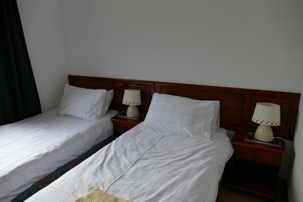 Postel nebo postele na pokoji v ubytování Wallace Lodge