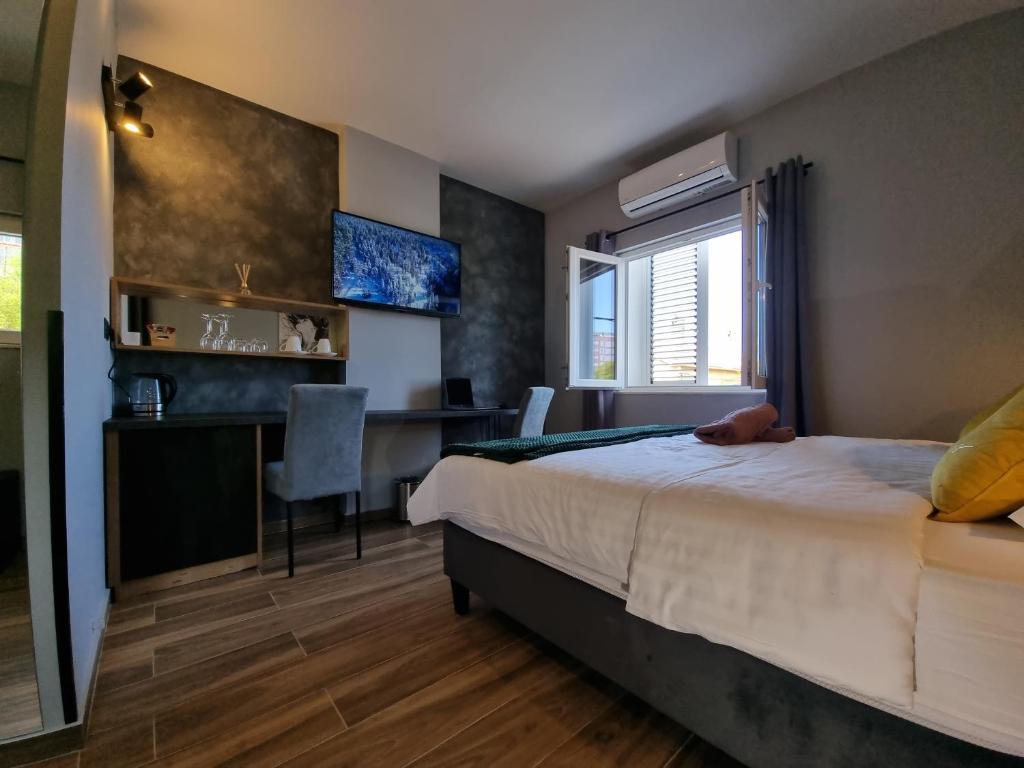 Postel nebo postele na pokoji v ubytování Solemar Luxury Rooms Free Parking