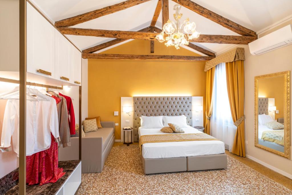 Posteľ alebo postele v izbe v ubytovaní Residenza La Duchessa Deluxe Rooms