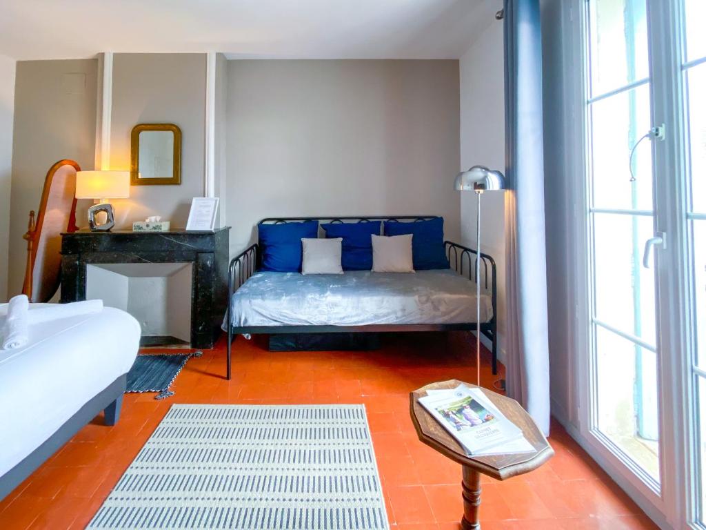 Postel nebo postele na pokoji v ubytování Entre Midi - Maison d'Hôtes - B&B