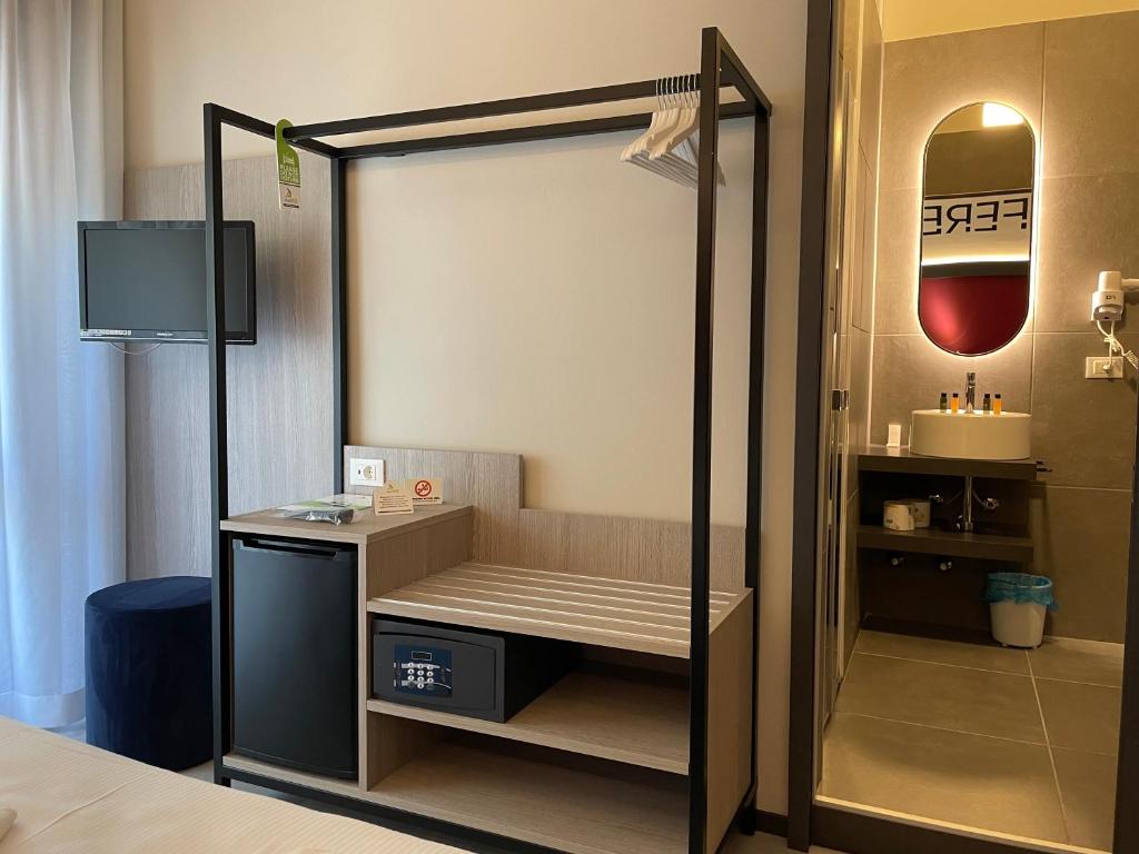 Postel nebo postele na pokoji v ubytování Hotel Iris Jesolo
