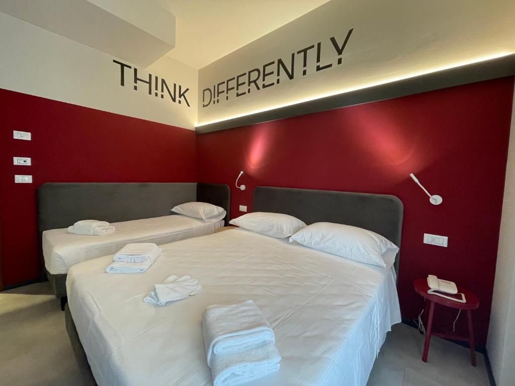 Postel nebo postele na pokoji v ubytování Hotel Iris Jesolo
