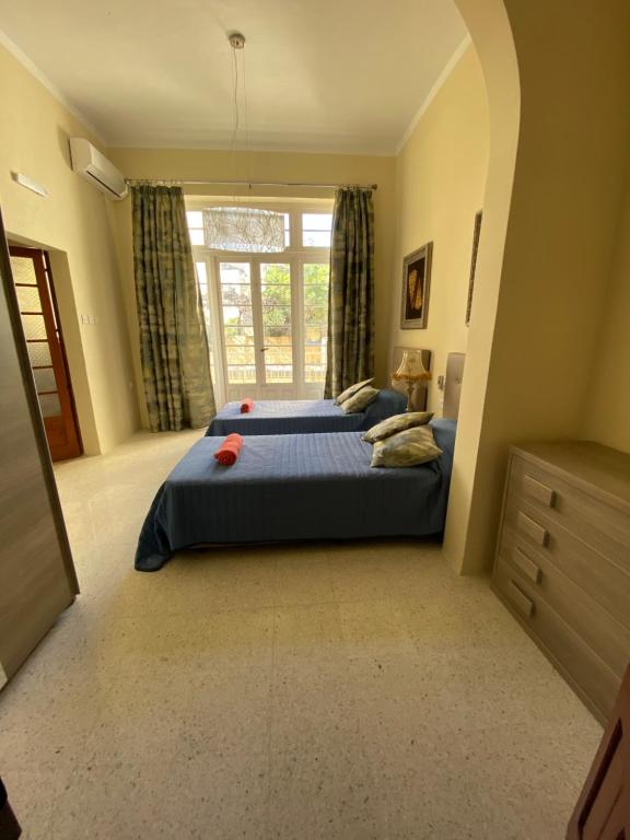 Postel nebo postele na pokoji v ubytování Magical Casalgo House