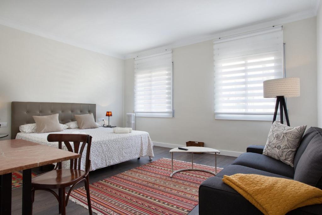 Posteľ alebo postele v izbe v ubytovaní Consell de Cent Apartment