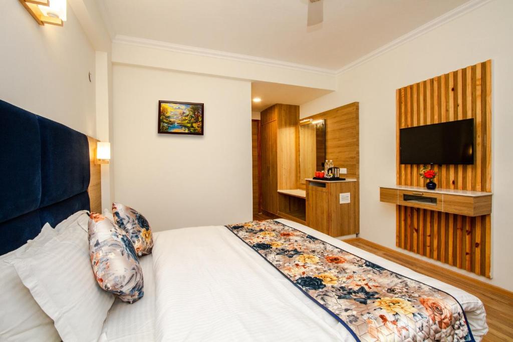 Postel nebo postele na pokoji v ubytování Anand Vardhan Resorts
