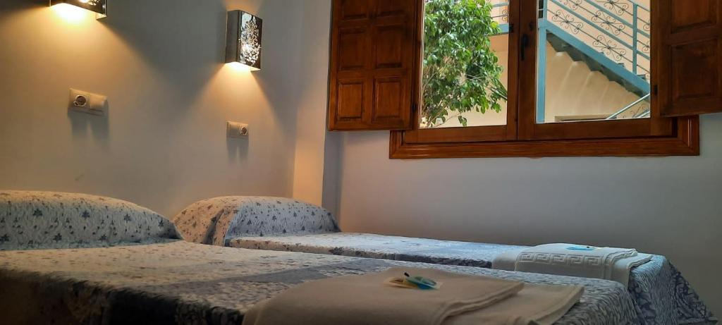 Postel nebo postele na pokoji v ubytování LA CASA MORISCA