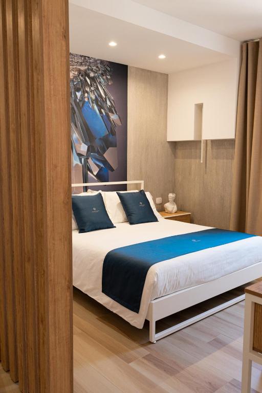 Postel nebo postele na pokoji v ubytování Antonio Busco rooms